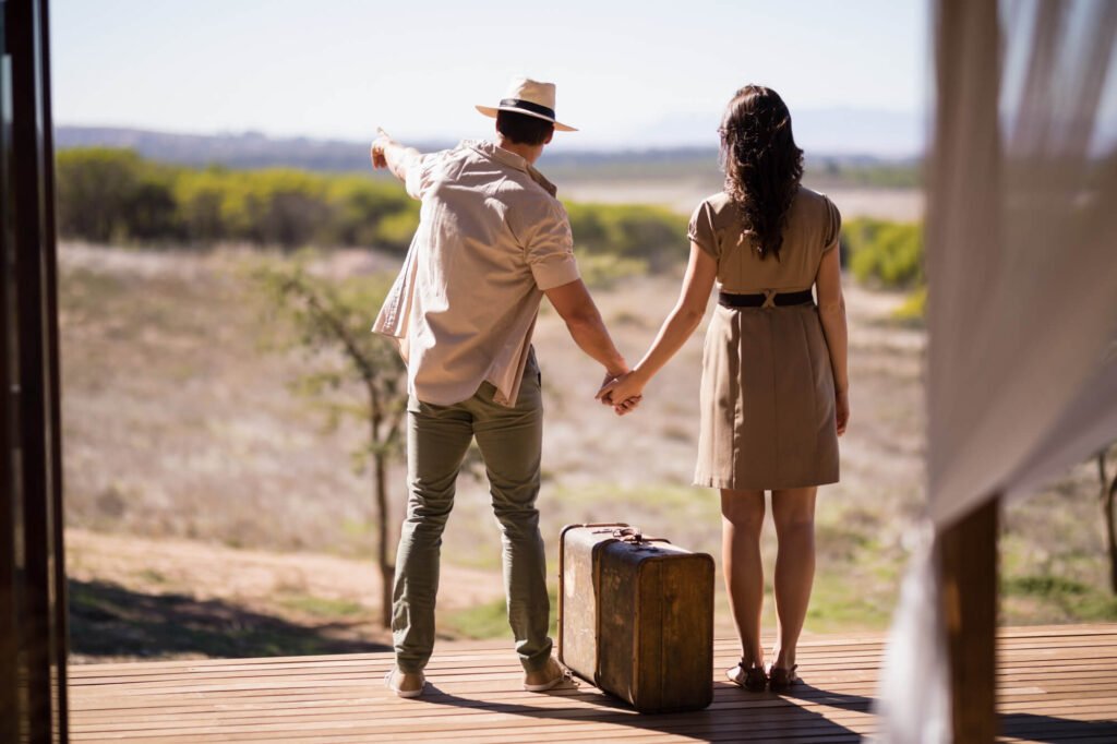 Couple arriving for a honeymoon safari in Tanzania with luggage